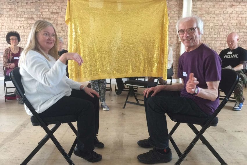 Morris Space, creative engagement group sitting on chairs and acting out a play