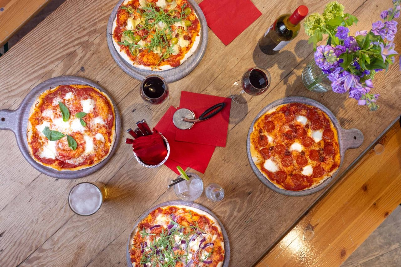 Photo of delicious pizza and wine on a table