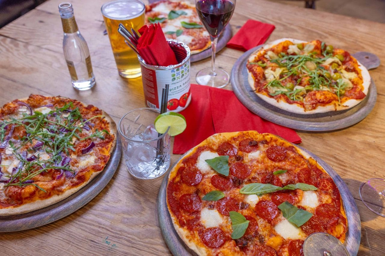 Photo of delicious pizza and wine on a table