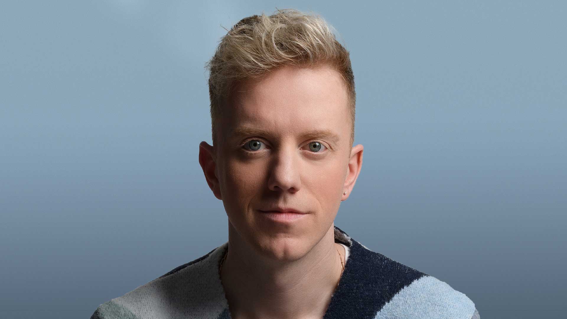 A headshot of comedian James Barr