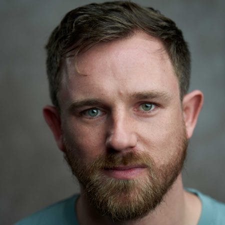 A headshot of actor Ben Ainsworth.
